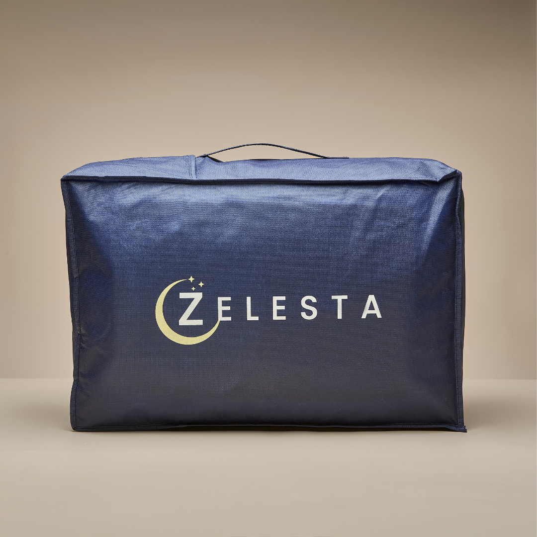 A spacious black rectangular fabric bag with a top handle and "ZELESTA" printed on the front, featuring a crescent moon and stars around the Z—ideal for storing your Zelesta Velvetbed hypoallergenic duvet.