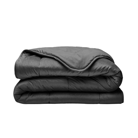The Zelesta Velvetbed - Anthracite is a dark gray, quilted luxury weighted blanket shown neatly folded against a plain white background.